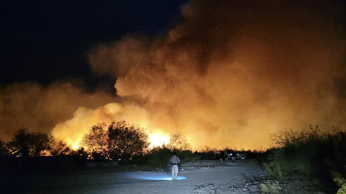 A wildfire is burning dangerously close to structures near Wikieup. Smoke can be seen for miles...