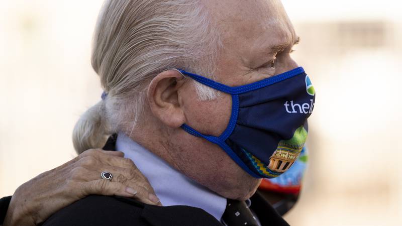 Former U.S. Rep. Ron Barber and his wife Nancy wrap their arms around each other during the...