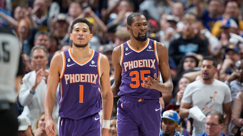 Phoenix Suns guard Devin Booker (1) and Phoenix Suns forward Kevin Durant (35) in the second...