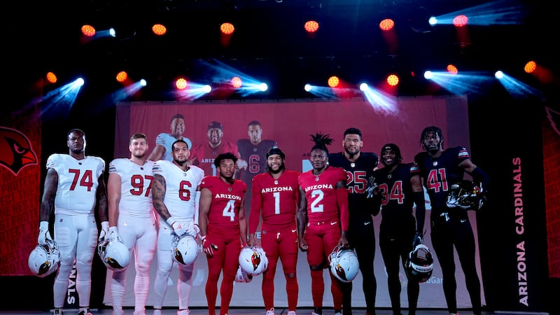 Arizona Cardinals quarterback Kyler Murray (1), flanked by teammates, showcase the NFL...