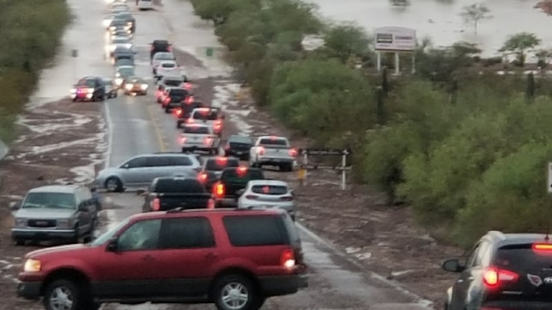 Traffic on Twin Peaks Road is snarled because of a flooded roadway in July 2018. (Source: See...