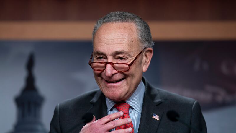 Senate Majority Leader Chuck Schumer, D-N.Y., speaks with reporters after Democratic Sen....