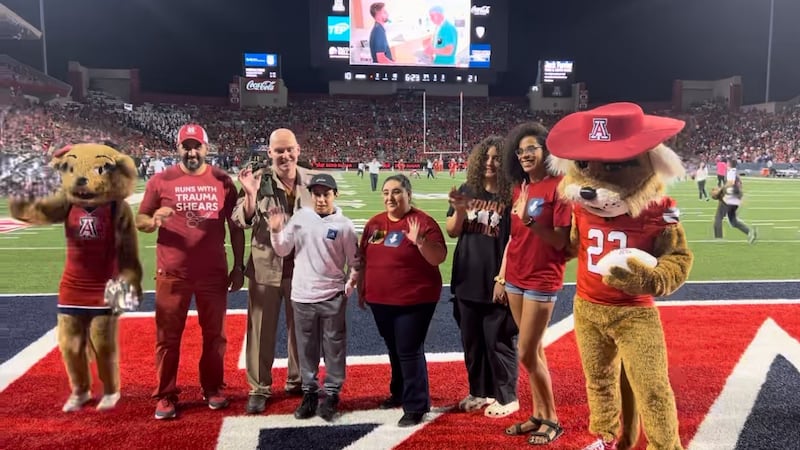 Tucson boy badly burned honored during UArizona Football Game