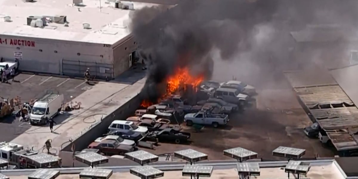 15 cars damaged in large fire at auto body shop in west Phoenix