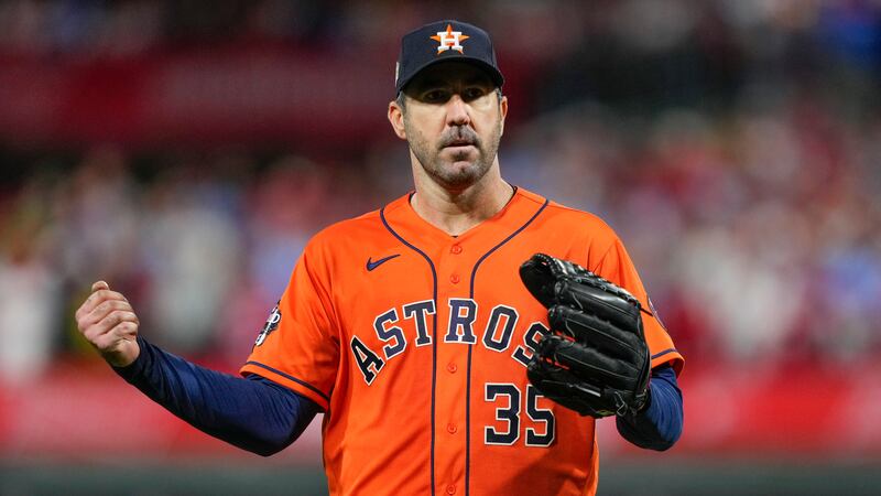 Houston Astros starting pitcher Justin Verlander celebrates the last out in the fifth inning...