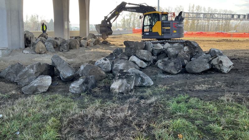 ODOT crews installing boulders under overpass