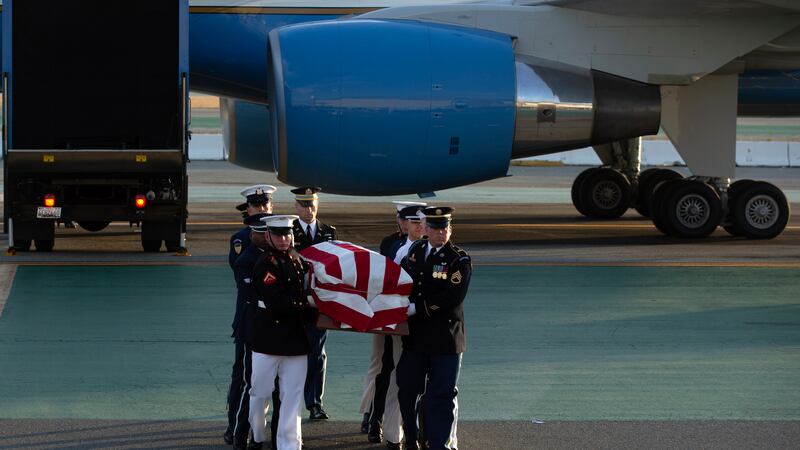 An armed forces color guard carries a casket containing the body of U.S. Sen. Dianne...