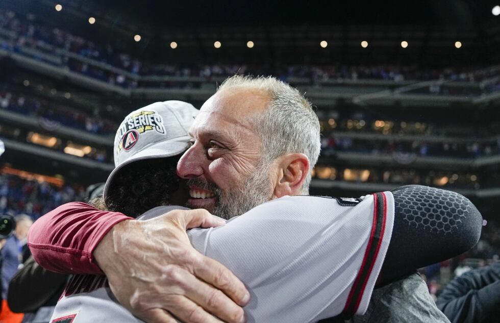 The Arizona Diamondbacks manager Torey Lovullo hugs Alek Thomas after their win against the...