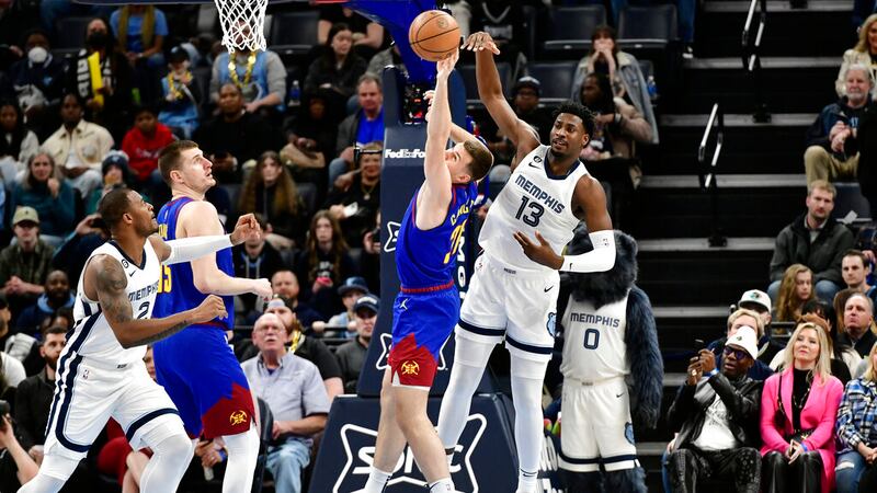 Memphis Grizzlies forward Jaren Jackson Jr. (13) and Denver Nuggets forward Vlatko Cancar (31)...