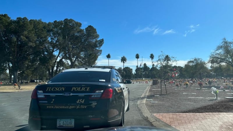 Officers from the Tucson Police Department investigate a report of a possible shooting at Holy...