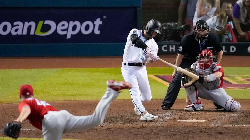 Arizona Diamondbacks' Alek Thomas hits a home run against the Philadelphia Phillies during the...