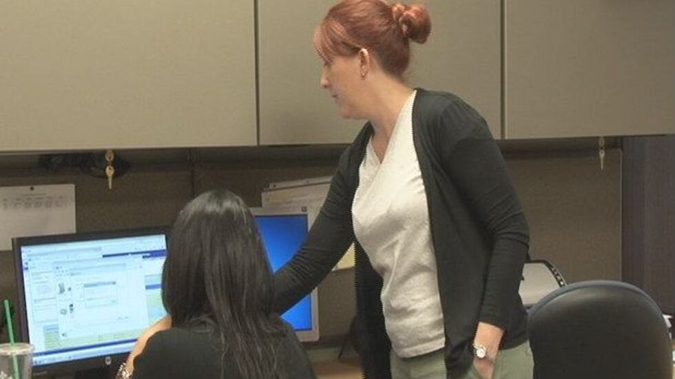 Registrar Terra Benson helps process veterans' records on a Saturday.