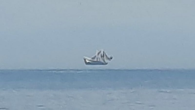 Oak Island beach goers had the chance to see a “hovering” ship on the water.