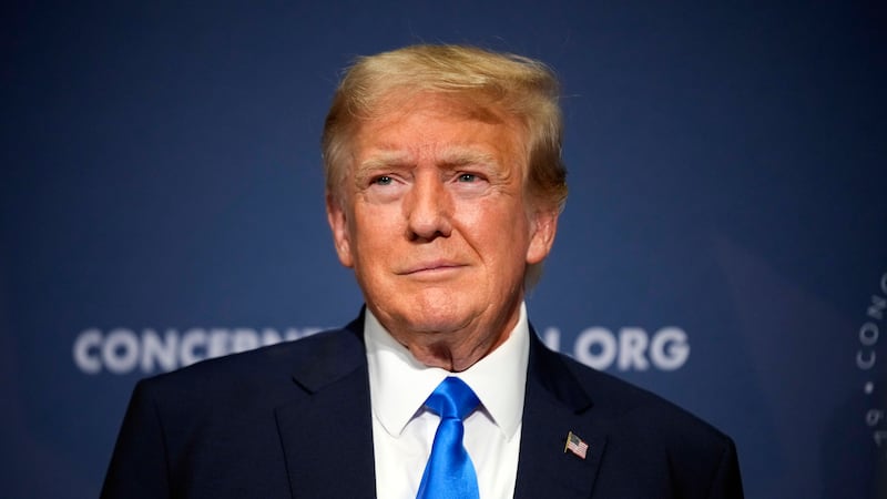 FILE - Former President Donald Trump stands on stage before speaking at a Concerned Women for...