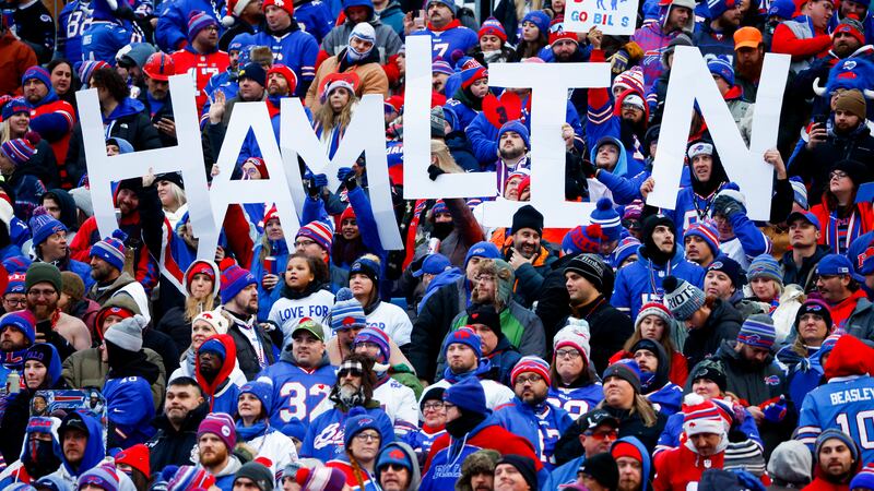Fans hold a sign in support of Buffalo Bills safety Damar Hamlin during the second half of an...