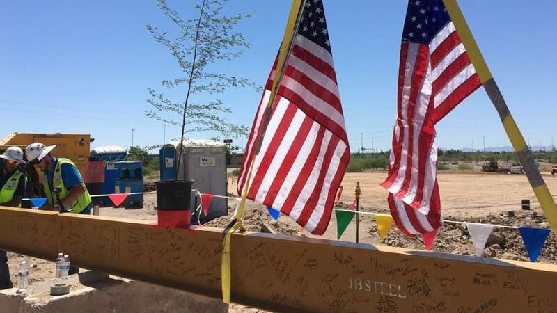 Last beam for Caterpillar building goes up. (Source: Tucson News Now)